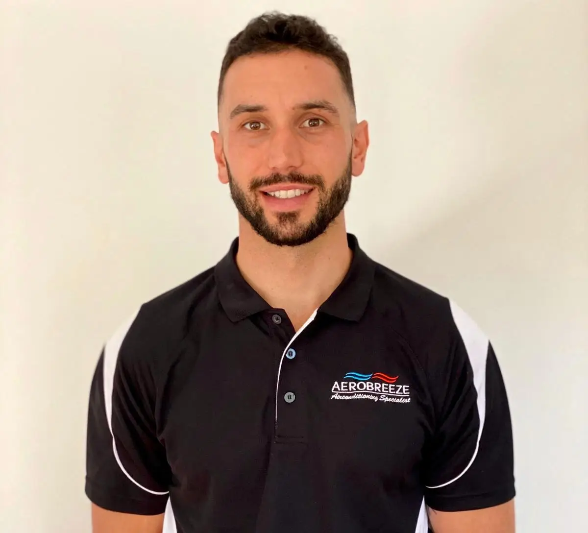 Maurice, owner of Aerobreeze Airconditioning, in uniform